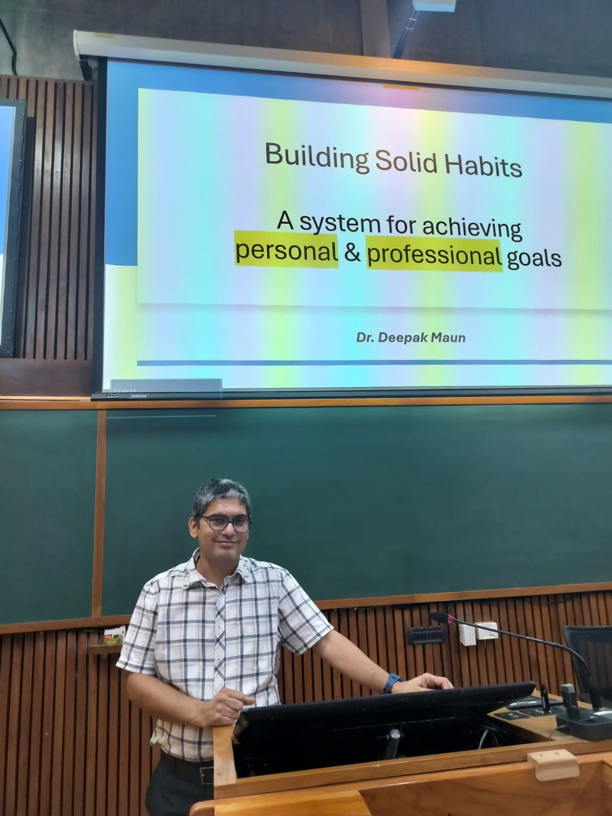 Deepak Maun presenting a talk on building solid habits