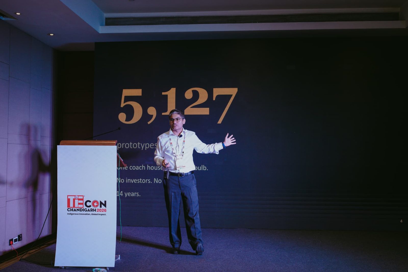 Deepak Maun speaking on stage